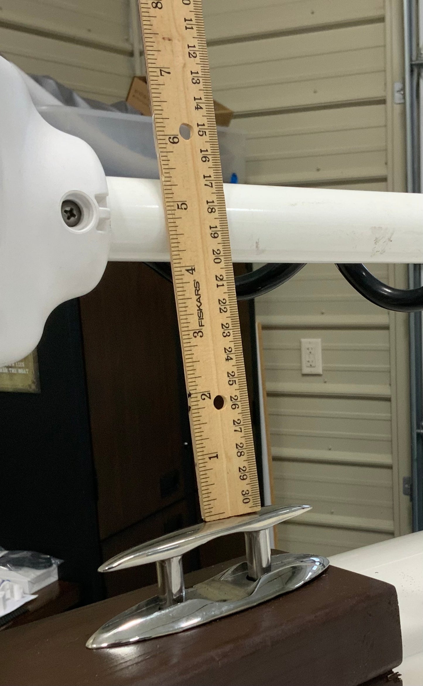 A ruler showing how to measure distance from bow rail to trolling motor