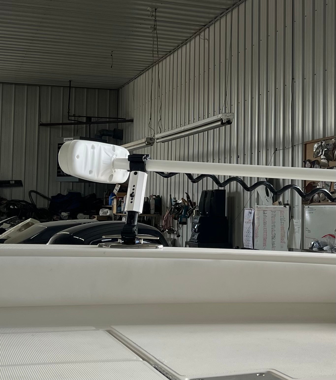 White Staymo trolling motor stabilizer attached to the boat pull up cleat